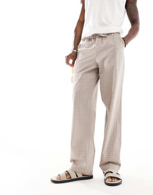Pantalones marrones holgados con bordado inglés y cinturilla elástica de ASOS DESIGN