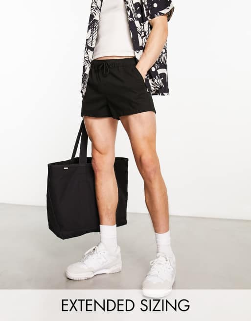 Pantalones muy cortos chinos negros de corte pitillo de ASOS DESIGN 