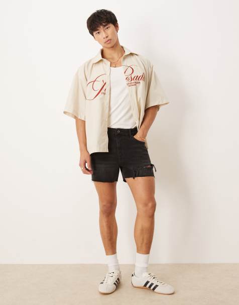 Pantalones muy cortos vaqueros de corte recto con lavado negro y detalle resgado de ASOS DESIGN - view 1
