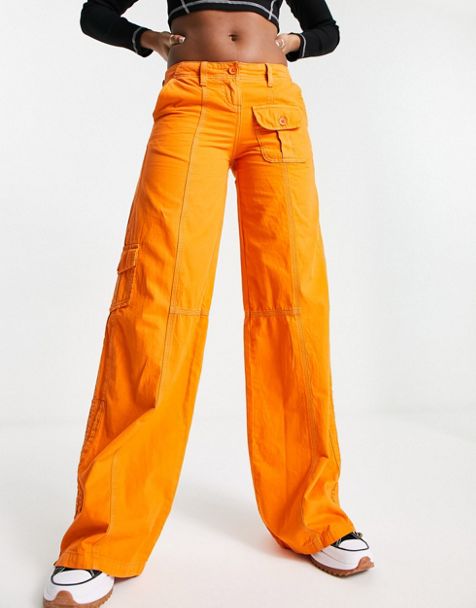 Pantalones naranjas de campana con detalle anudado a la cintura de punto de  COLLUSION