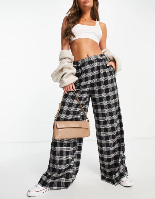 Pantalones negros a cuadros de pernera ancha de Pimkie
