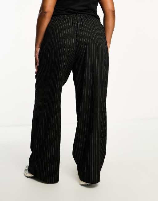 Pantalones negros con online rayas blancas