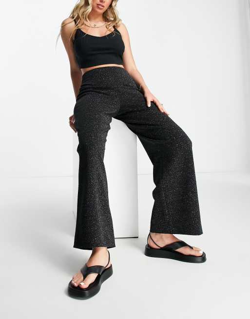 Pantalones negros brillantes de punto roma Ava de Whistles