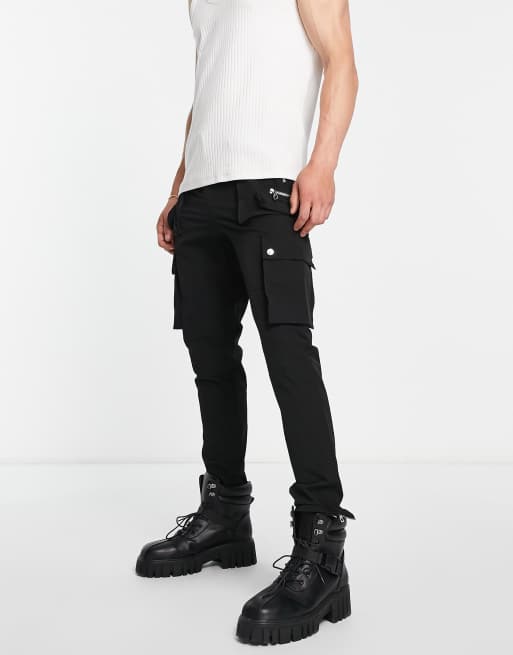 Pantalones negros cargo con varias cremalleras de The Couture Club