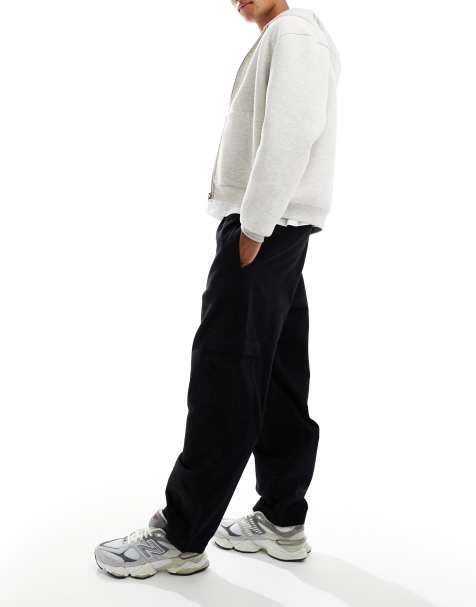 Pantalones negros cargo sin cierres de corte tapered holgado con pinzas de ASOS DESIGN - view 1
