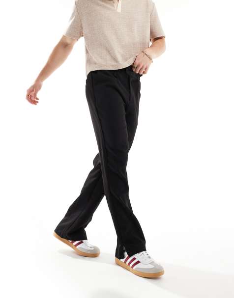 Pantalones negros con abertura en los bajos de The Couture Club - view 1