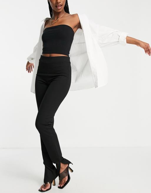 Pantalones negros con aberturas laterales de punto de NA-KD
