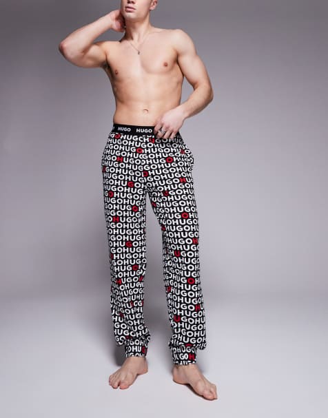 Pantalones negros con estampado integral del logo Tortuga de HUGO Bodywear - view 1