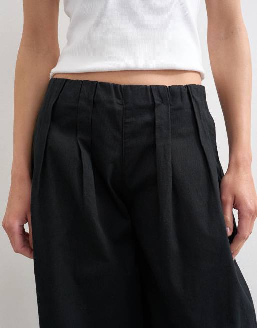 Pantalones negros de corte globo de popelina de Topshop, 3 de 5