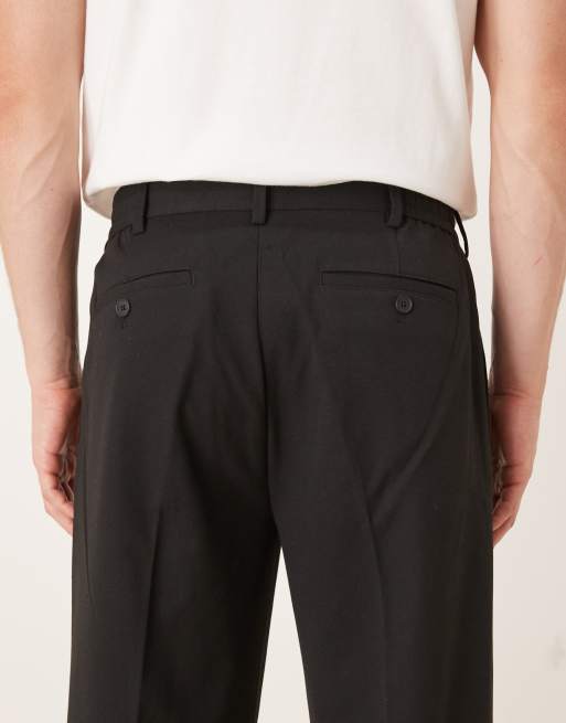 Pantalones negros de corte suelto con pinzas de Selected , 4 de 5