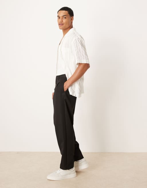 Pantalones negros de corte tapered extragrande con dos pinzas de ASOS DESIGN , 3 de 5