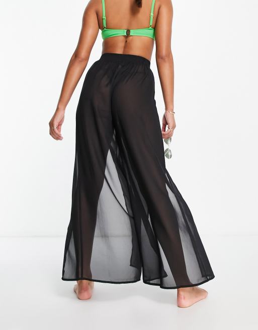 Pantalones negros de pernera ancha con abertura frontal de tejido transparente de ASOS DESIGN, 2 de 4