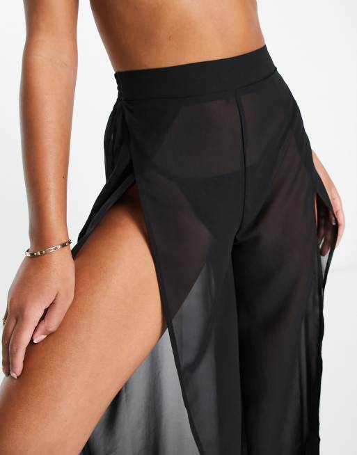 Pantalones negros de pernera ancha con abertura frontal de tejido transparente de ASOS DESIGN, 3 de 4