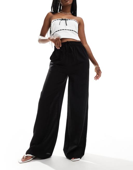 Pantalones negros de pernera ancha con cordón ajustable de mezcla de lino de In The Style