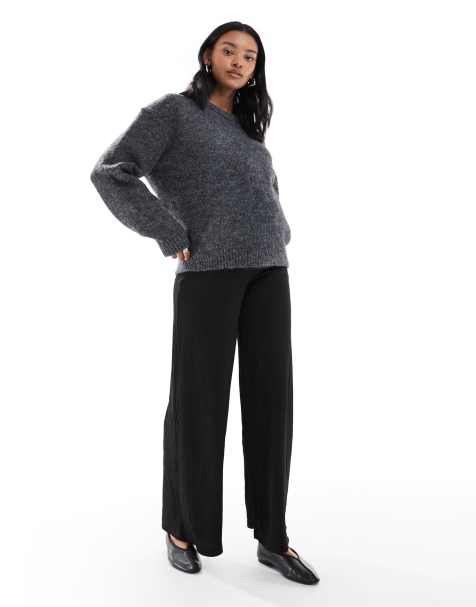 Pantalones negros de pernera ancha con detalle de lazada en la cintura de punto liso de Mamalicious - view 1