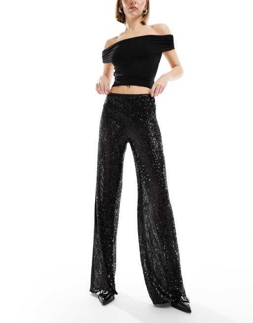 Pantalones negros de pernera ancha de lentejuelas de Mango