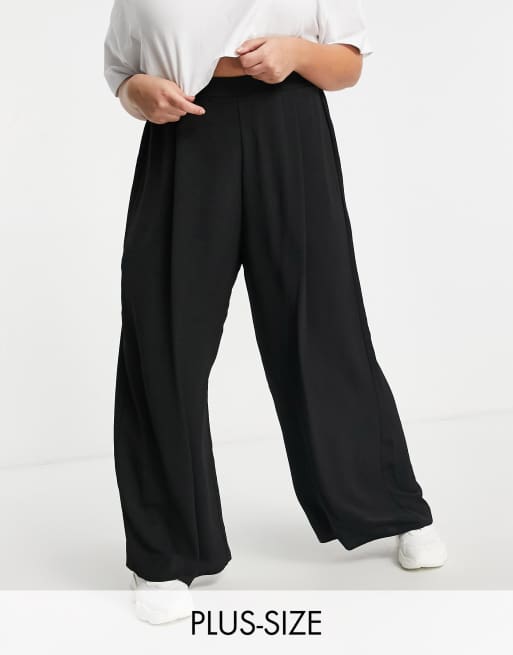 Pantalones negros de pernera ancha de New Look Curve
