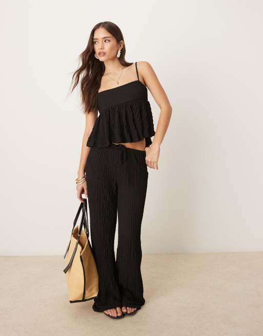 Pantalones negros de pernera recta de tejido texturizado de Mango (parte de un conjunto)