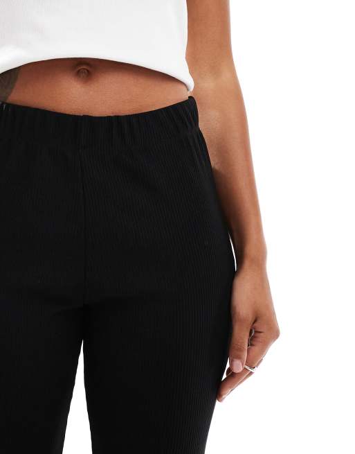Pantalones negros de talle alto y corte acampanado de canalé de ONLY, 4 de 5
