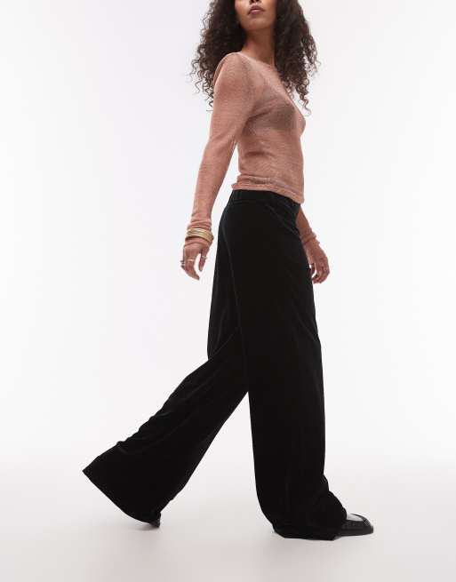Pantalones negros de talle alto y pernera ancha de terciopelo de Mango