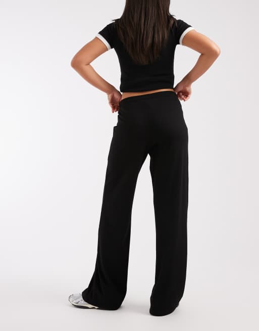 Pantalones negros de talle medio y pernera ancha de punto liso de Pieces, 3 de 5