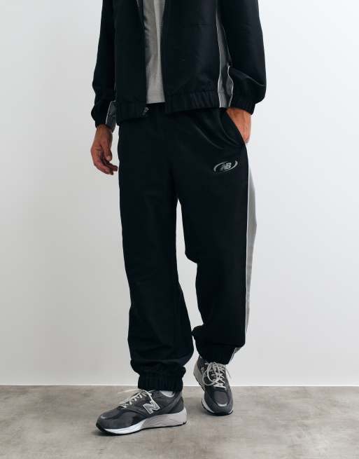Pantalones negros de tejido liso Trackside de New Balance, 2 de 5