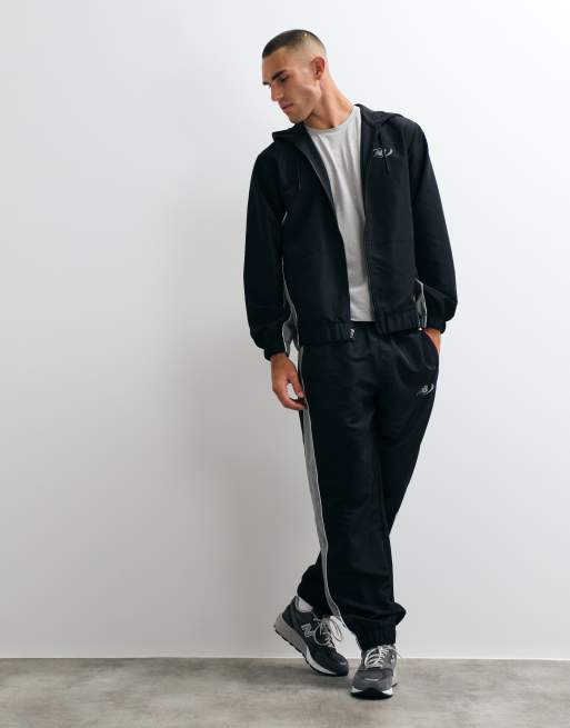 Pantalones negros de tejido liso Trackside de New Balance, 5 de 5