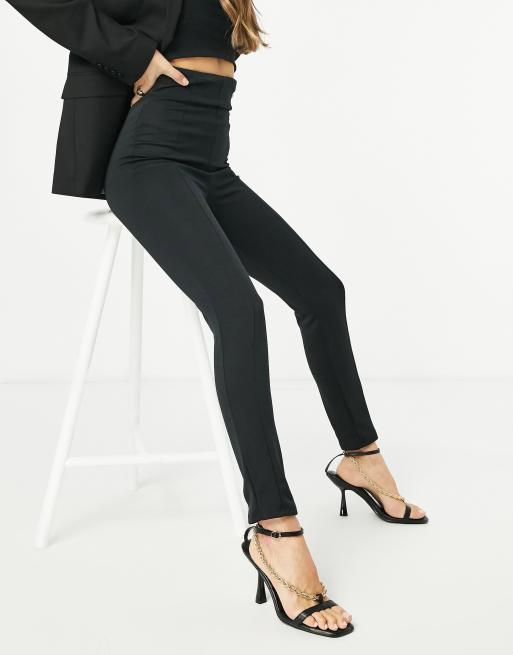 Pantalones negros elásticos de sastre y tiro alto de Flounce London