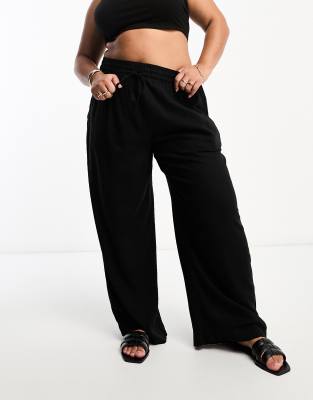 Pantalones negros sin cierres de mezcla de lino de ASOS DESIGN Curve