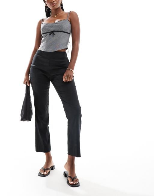 Pantalones negros sin cierres de mezcla de lino elástico de Mango
