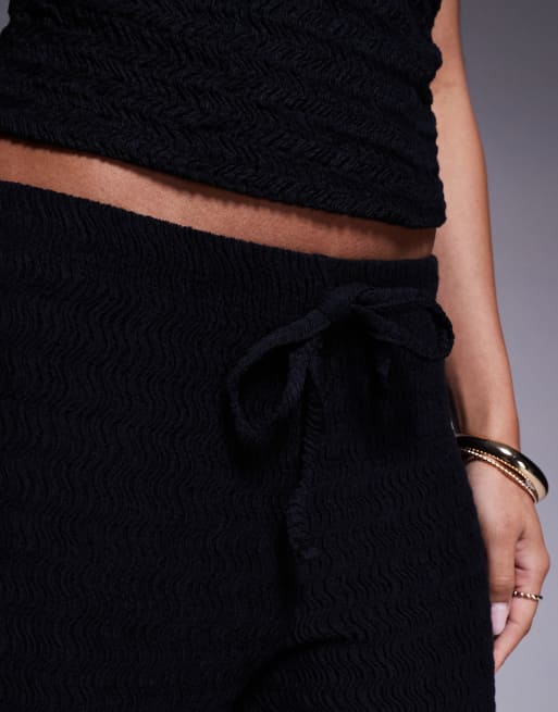 Pantalones negros sin cierres de pernera ancha de tejido texturizado de ASOS DESIGN, 5 de 5