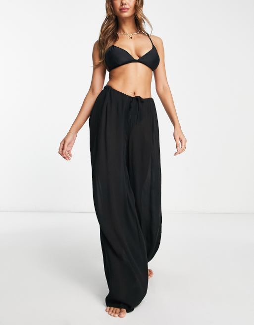 Pantalones de playa de malla de punto transparente con volantes en negro de  ASOS DESIGN 