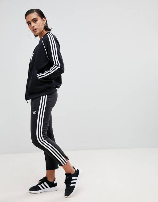 Flotar chico Bisagra Pantalones pitillo con detalle de tres rayas en negro de adidas Originals |  ASOS