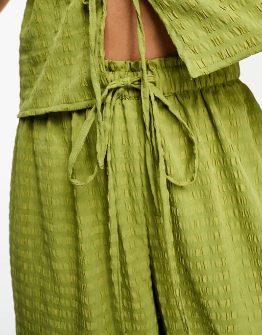 Pantalones playeros verdes de pernera ancha texturizados