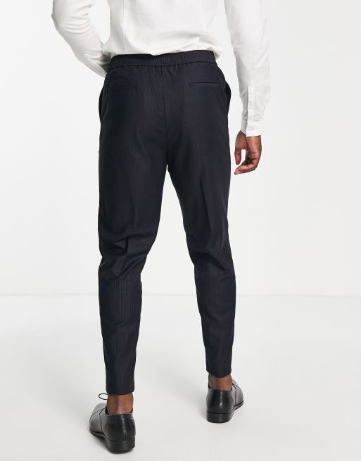 Pantalones de vestir plisados de corte tapered y talle alto de Devil's  Advocate Tall