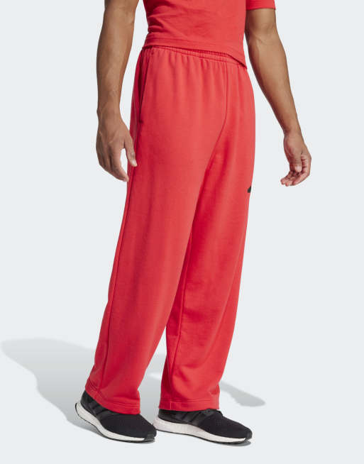 Pantalones rojo rubí y negros de pernera ancha con logo de 3 bandas Essentials de adidas Performance, 3 de 4