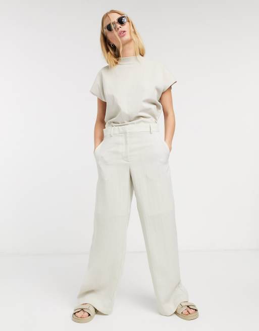 Pantalones tapered de lino en beis natural Mono de Weekday
