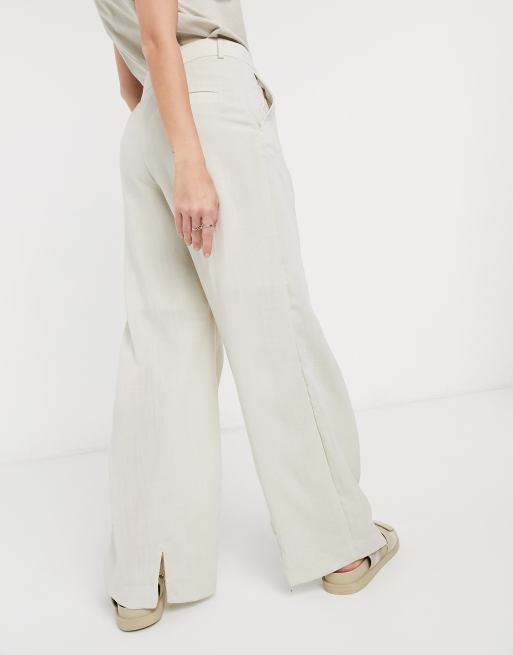 Pantalones tapered de lino en beis natural Mono de Weekday, 2 de 4