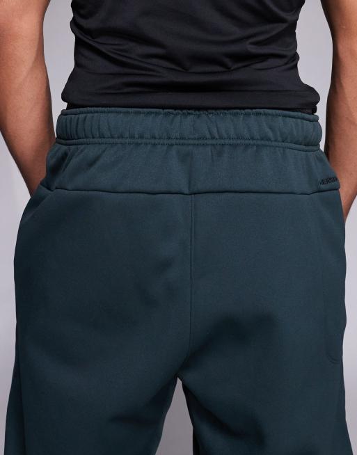 Pantalones verdes de corte tapered Therma de Nike Training, 4 de 5