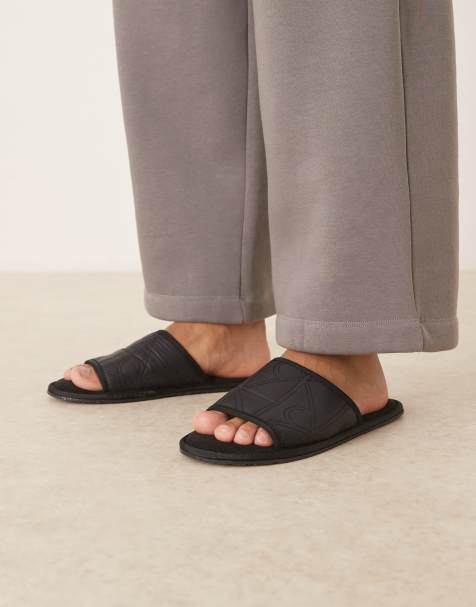 Pantuflas negras sin cierres con estampado integral de Calvin Klein - view 1