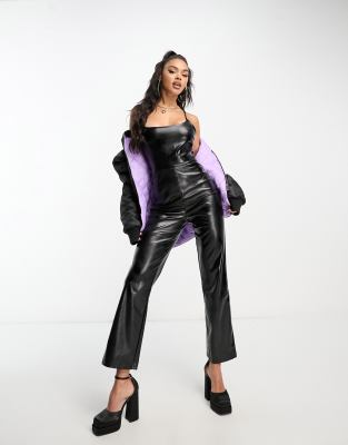 Parisian faux leather belted long sleeve jumpsuit in black