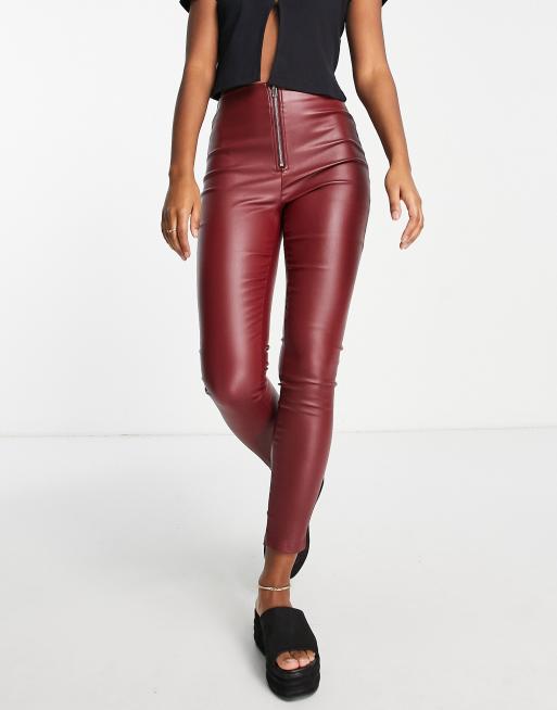 Parisian faux leather pants with exposed zip in wine