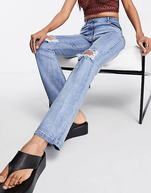 Parisian high waist straight leg jeans with ripped knee in blue