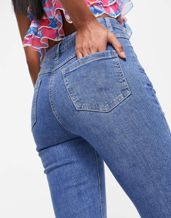 https://images.asos-media.com/products/parisian-kick-flare-jeans-in-mid-blue/202437842-3?$n_550w$&wid=550&fit=constrain
