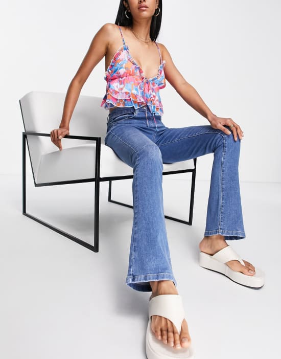 https://images.asos-media.com/products/parisian-kick-flare-jeans-in-mid-blue/202437842-4?$n_550w$&wid=550&fit=constrain