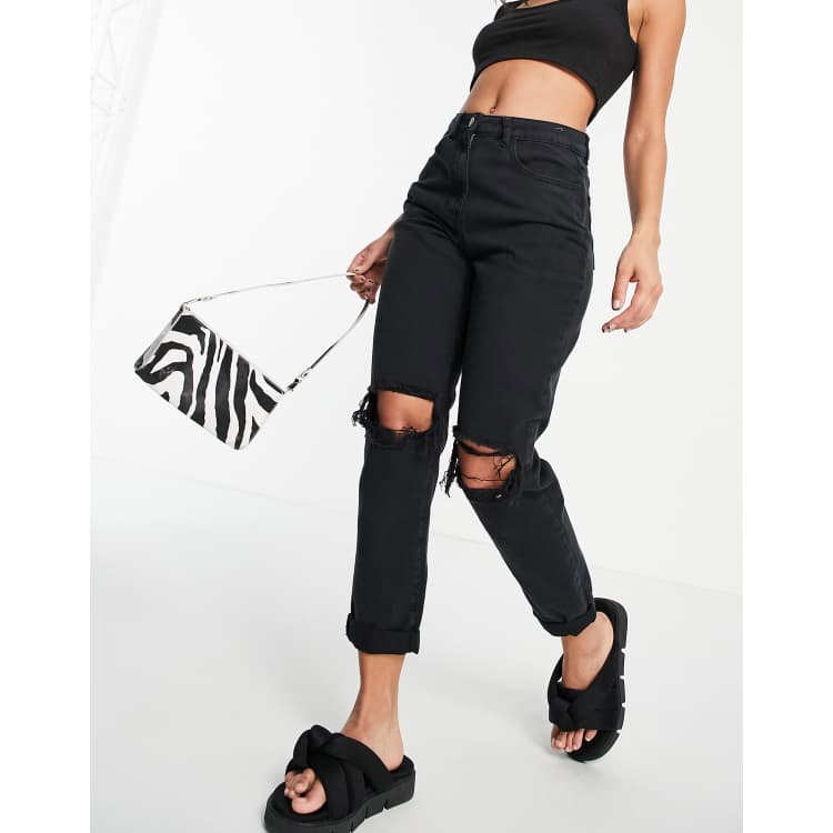 Black jeans with store rips