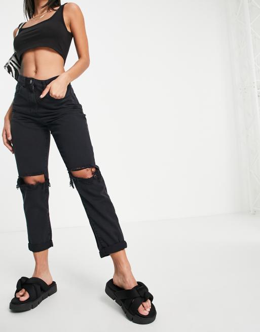 Parisian skinny jeans with ripped knee in black