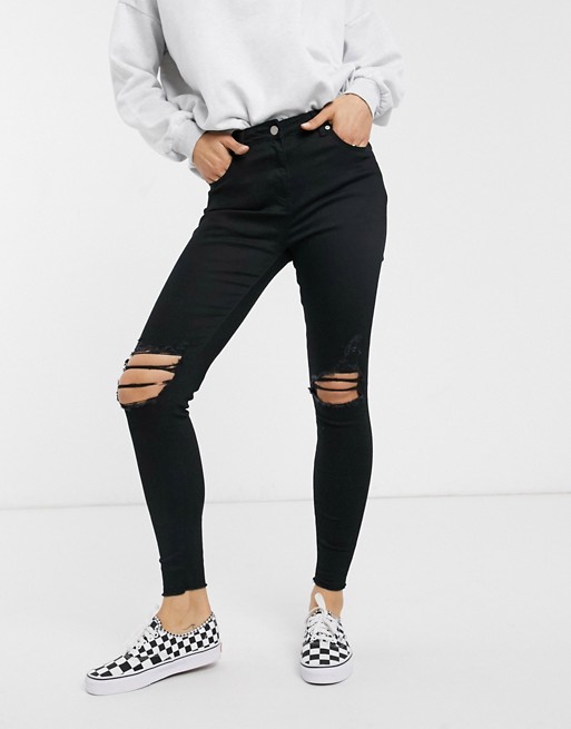 Parisian skinny jeans with distressed knee rips
