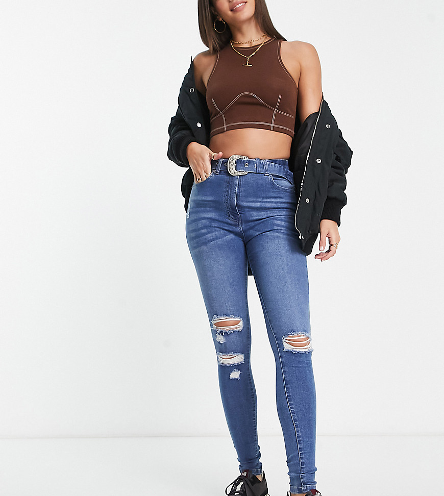 belted skinny jeans in mid blue