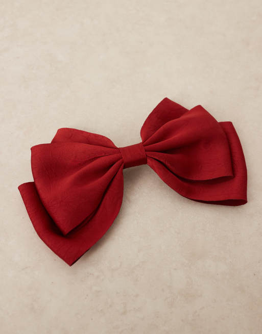 Pasador para el cabello con lazo grande rojo de satén de ASOS DESIGN, 2 de 3